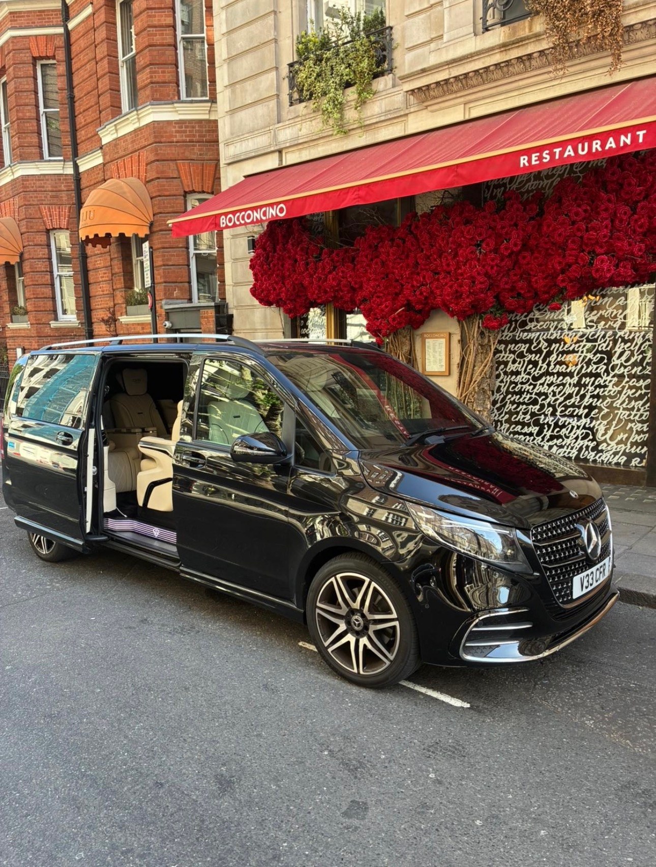 Black Mercedes V-Class Landjet parked outside a restaurant